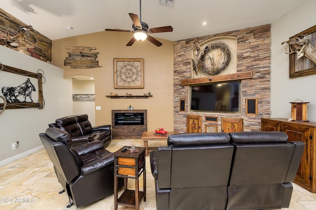 living room with ceiling fan and lofted ceiling