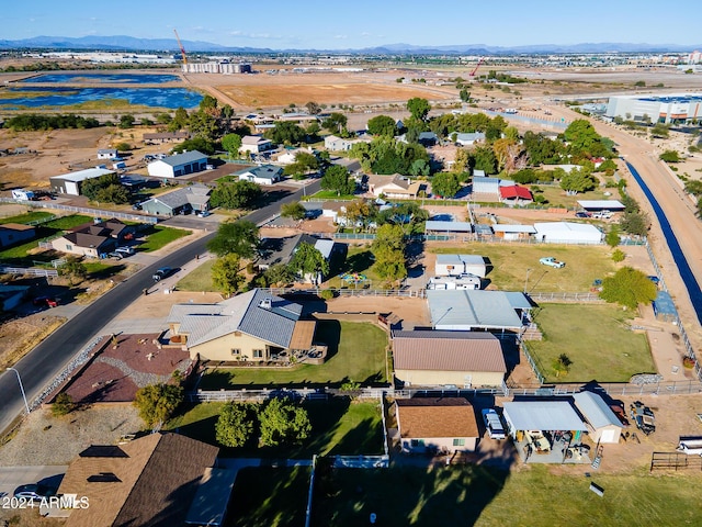 birds eye view of property with a mountain view