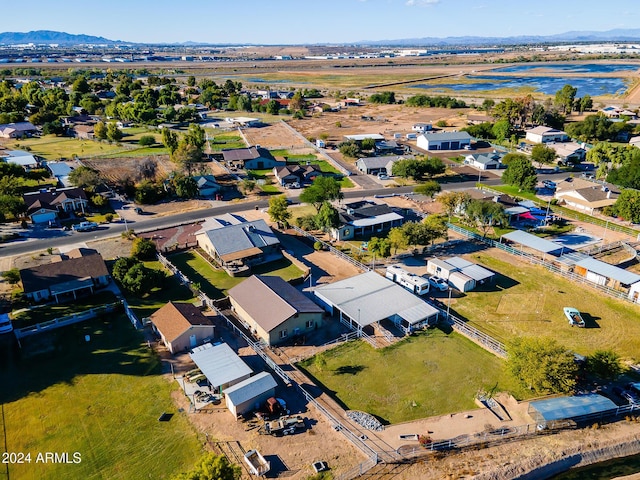 drone / aerial view with a water and mountain view