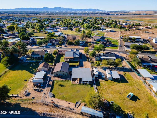 birds eye view of property with a mountain view