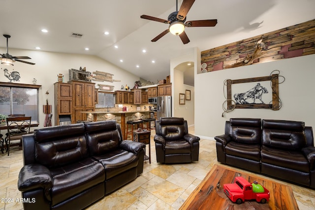 5701 N 105th Ln, Glendale, AZ 85307 - living room featuring a ceiling fan, stone tile flooring, high vaulted ceiling, and recessed lighting