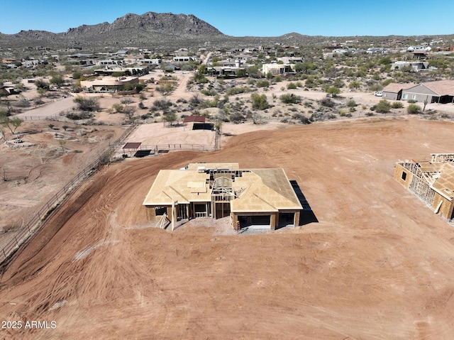 birds eye view of property with a mountain view