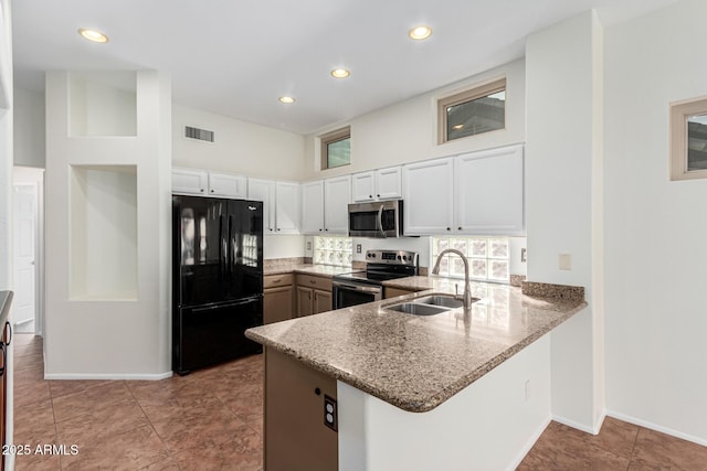 kitchen with sink, white cabinets, kitchen peninsula, and stainless steel appliances