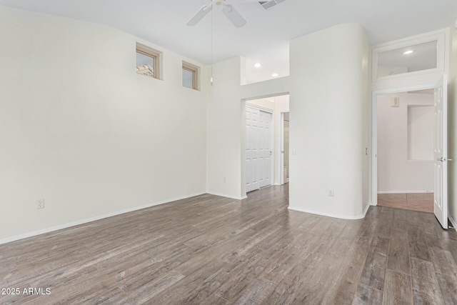 spare room with wood-type flooring and ceiling fan