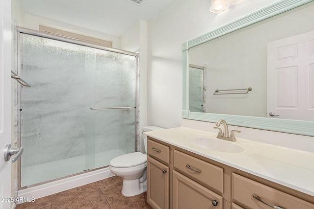 bathroom featuring vanity, toilet, an enclosed shower, and tile patterned flooring