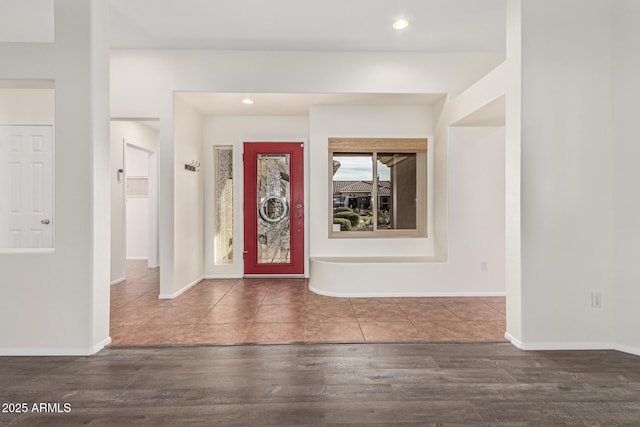 entrance foyer with dark hardwood / wood-style floors