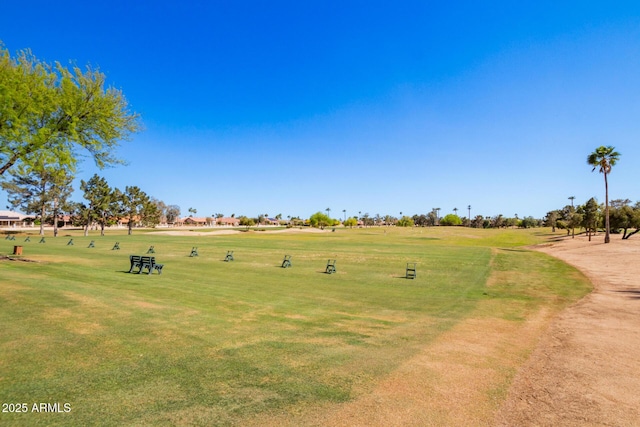 view of property's community featuring a yard