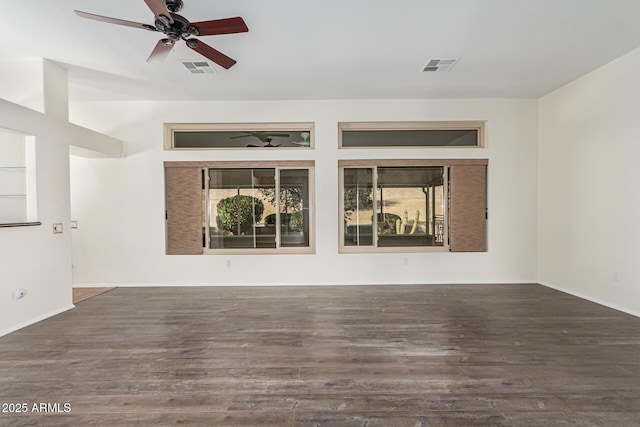 spare room with ceiling fan and dark hardwood / wood-style flooring