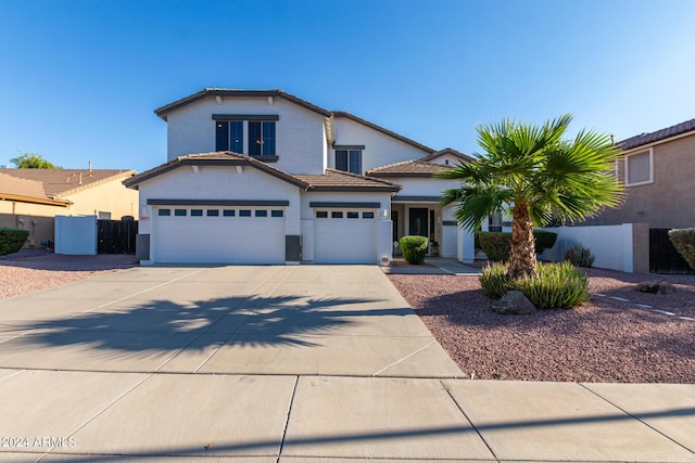 2977 E County Down Dr, Chandler, AZ 85249 - traditional-style house with an attached garage, concrete driveway, a tile roof, fence, and stucco siding