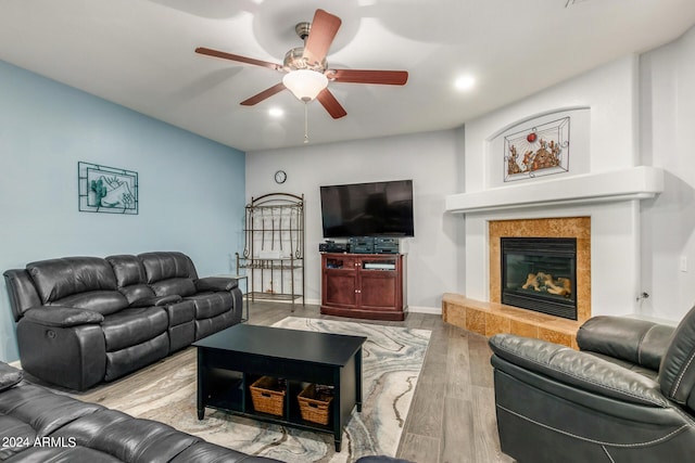 2977 E County Down Dr, Chandler, AZ 85249 - living room with a tiled fireplace, recessed lighting, a ceiling fan, and wood finished floors