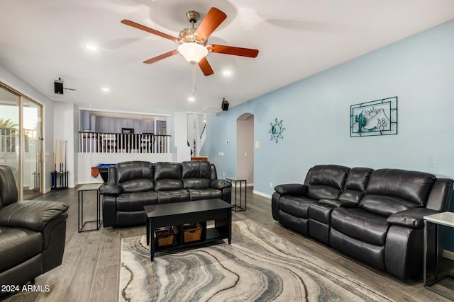 2977 E County Down Dr, Chandler, AZ 85249 - living room featuring baseboards, recessed lighting, a ceiling fan, arched walkways, and wood finished floors