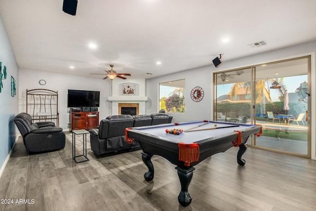 2977 E County Down Dr, Chandler, AZ 85249 - recreation room with ceiling fan, recessed lighting, a glass covered fireplace, and wood finished floors