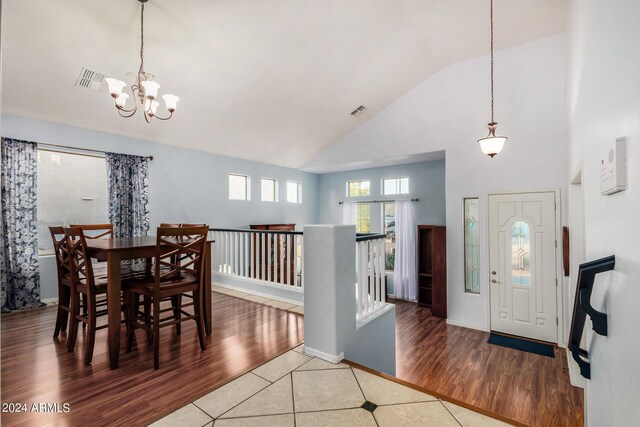 2977 E County Down Dr, Chandler, AZ 85249 - entryway with high vaulted ceiling, a notable chandelier, visible vents, and wood finished floors