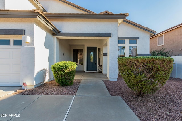 2977 E County Down Dr, Chandler, AZ 85249 - doorway to property with a tiled roof, a garage, and stucco siding