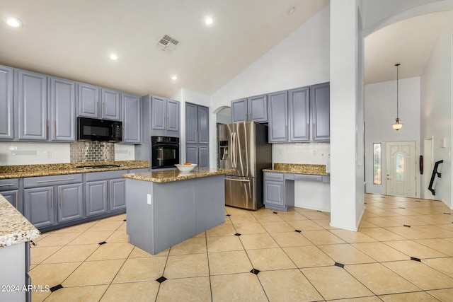 2977 E County Down Dr, Chandler, AZ 85249 - kitchen with visible vents, high vaulted ceiling, gray cabinetry, and black appliances