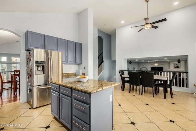 2977 E County Down Dr, Chandler, AZ 85249 - kitchen featuring high vaulted ceiling, arched walkways, stainless steel fridge, and ceiling fan