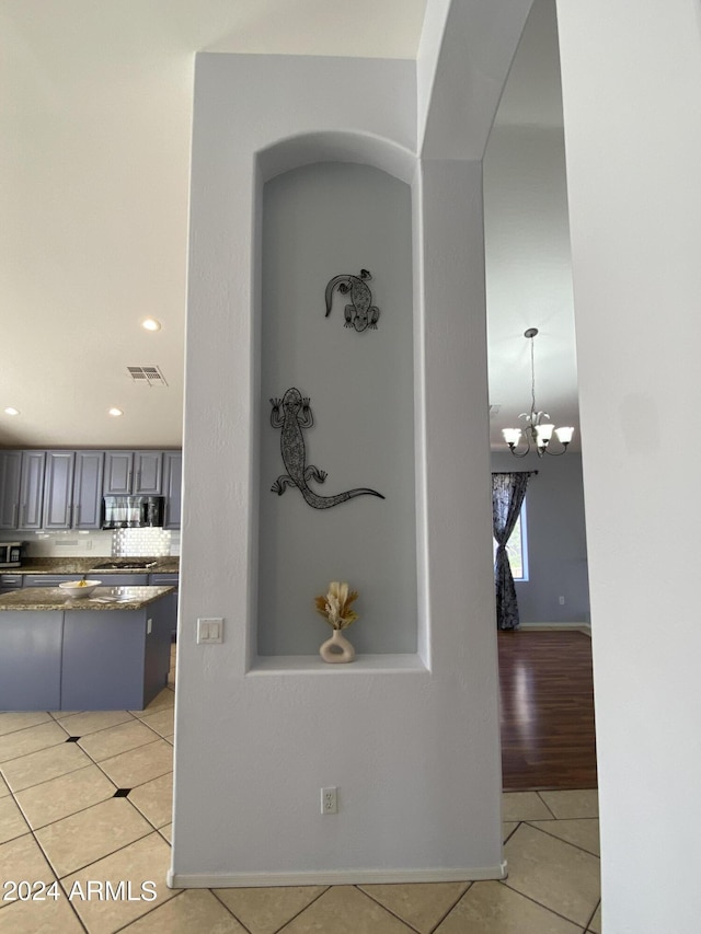 2977 E County Down Dr, Chandler, AZ 85249 - hall with a chandelier, recessed lighting, light tile patterned flooring, visible vents, and arched walkways
