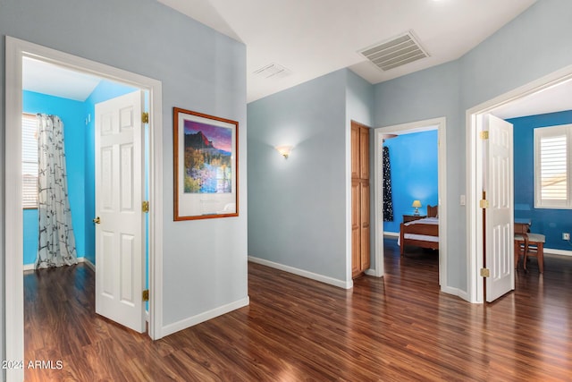 2977 E County Down Dr, Chandler, AZ 85249 - hallway with visible vents, dark wood-style flooring, and baseboards