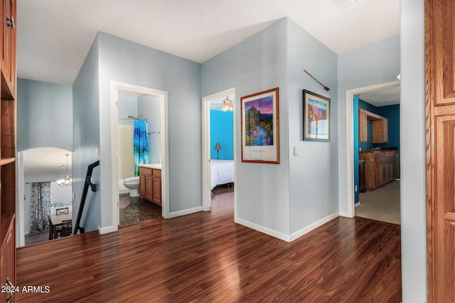 2977 E County Down Dr, Chandler, AZ 85249 - hall featuring dark wood-type flooring, arched walkways, and baseboards