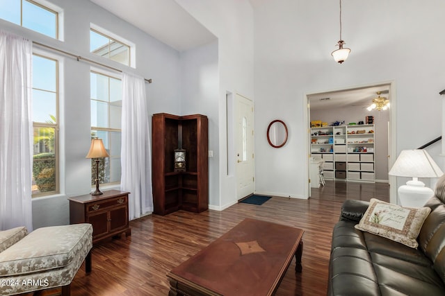 2977 E County Down Dr, Chandler, AZ 85249 - living area with ceiling fan, wood finished floors, a towering ceiling, and baseboards