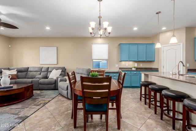 dining space with a chandelier, recessed lighting, a ceiling fan, and light tile patterned floors