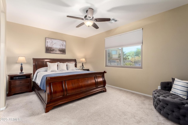 bedroom with light carpet, baseboards, and a ceiling fan