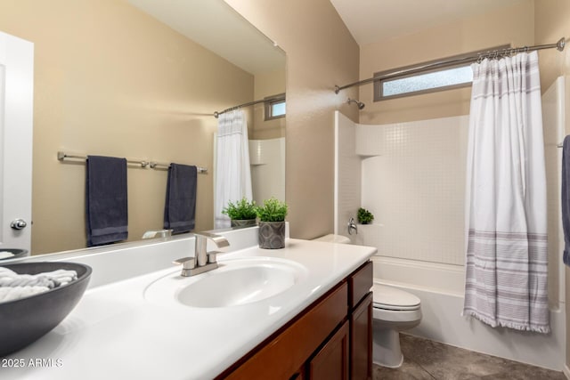 bathroom featuring vanity, toilet, and shower / bath combo with shower curtain