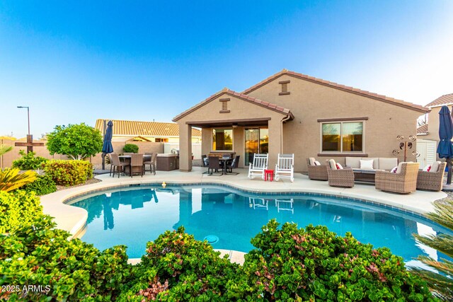 view of swimming pool with an outdoor hangout area, outdoor dining area, a patio area, and fence