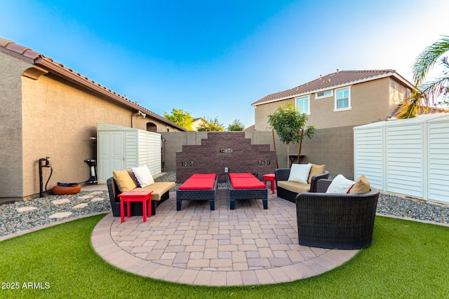 view of patio featuring an outdoor living space and a fenced backyard