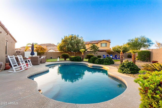 view of pool featuring a patio, a fenced backyard, and outdoor lounge area