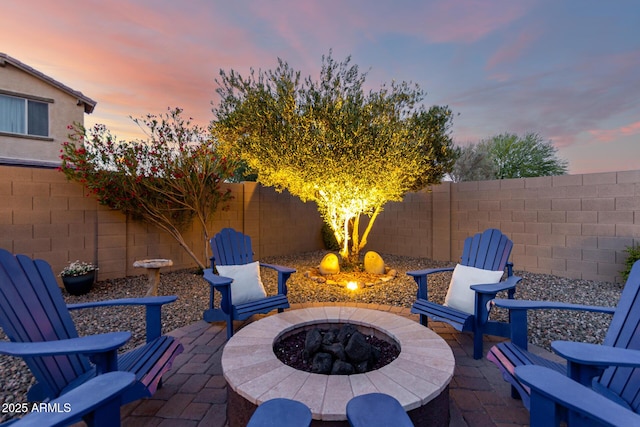 view of patio featuring a fire pit and a fenced backyard