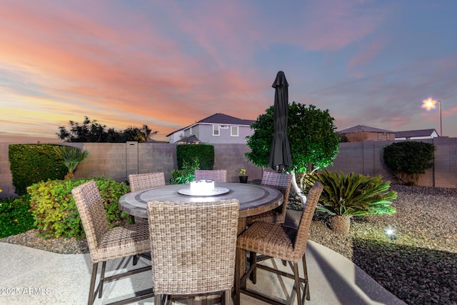 view of patio featuring a fenced backyard and outdoor dining area