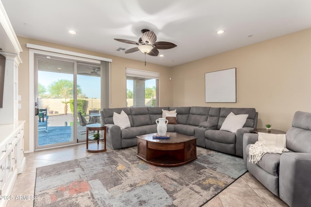 living area featuring ceiling fan, light tile patterned floors, and recessed lighting