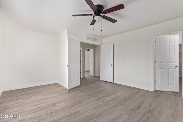 unfurnished bedroom featuring ceiling fan and light wood-type flooring