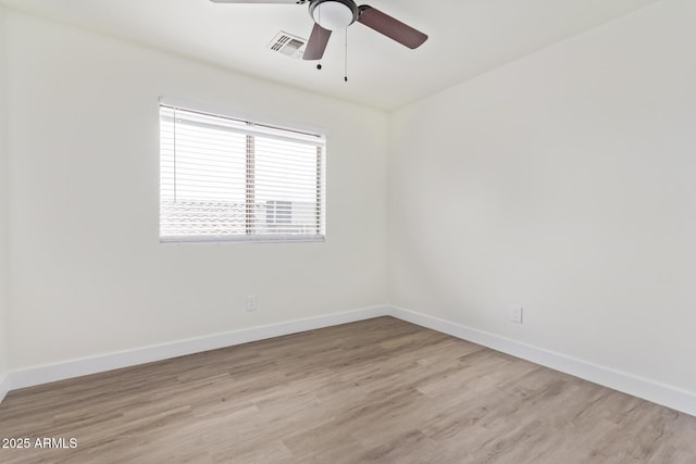 unfurnished room featuring ceiling fan and light wood-type flooring