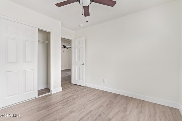 unfurnished bedroom featuring a closet, ceiling fan, and light hardwood / wood-style flooring