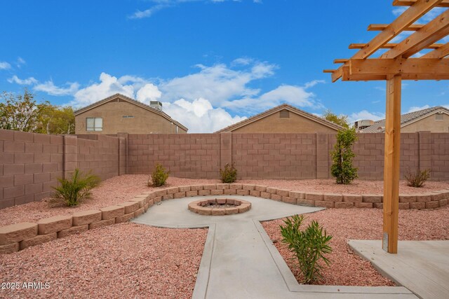 view of yard with a patio and a fire pit