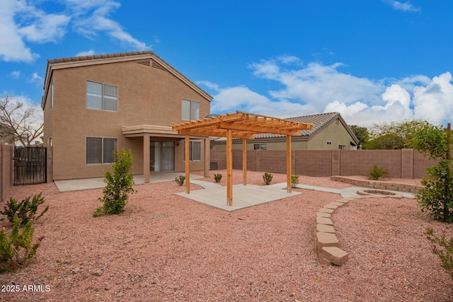 back of house featuring a pergola and a patio area