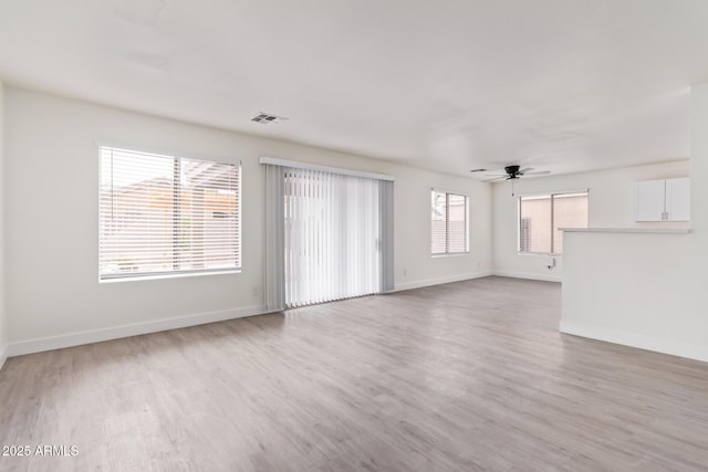 spare room featuring ceiling fan and wood-type flooring