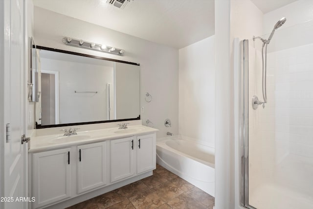 bathroom with vanity and shower with separate bathtub