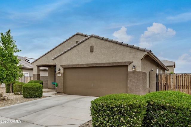 17573 W Via De Luna Dr, Surprise, AZ 85387 - view of front of property with stucco siding, an attached garage, concrete driveway, and a tile roof