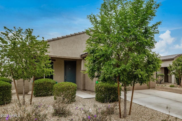 17573 W Via De Luna Dr, Surprise, AZ 85387 - view of front of property featuring stucco siding, concrete driveway, and a tile roof