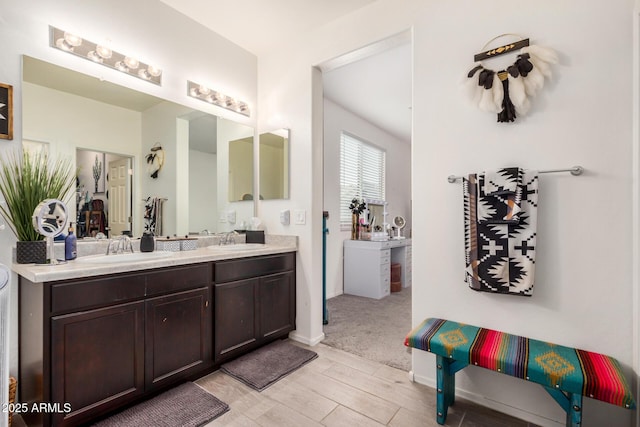 17573 W Via De Luna Dr, Surprise, AZ 85387 - full bathroom with double vanity and wood finished floors