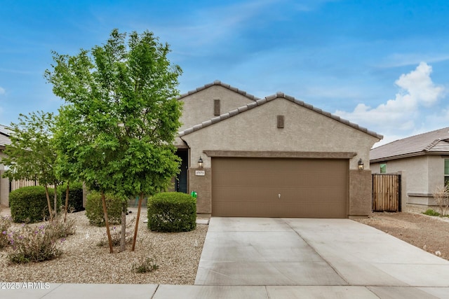 17573 W Via De Luna Dr, Surprise, AZ 85387 - view of front facade with an attached garage, stucco siding, concrete driveway, and a tiled roof