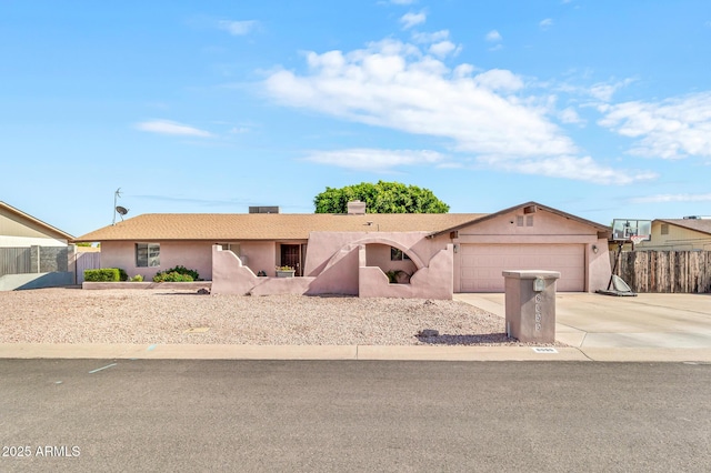 6055 E Hannibal St, Mesa, AZ 85205 - view of front of property with an attached garage, driveway, and stucco siding