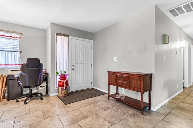 6055 E Hannibal St, Mesa, AZ 85205 - foyer with light tile patterned floors and baseboards