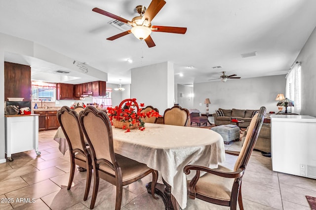 6055 E Hannibal St, Mesa, AZ 85205 - dining space with a ceiling fan, healthy amount of natural light, and light tile patterned flooring