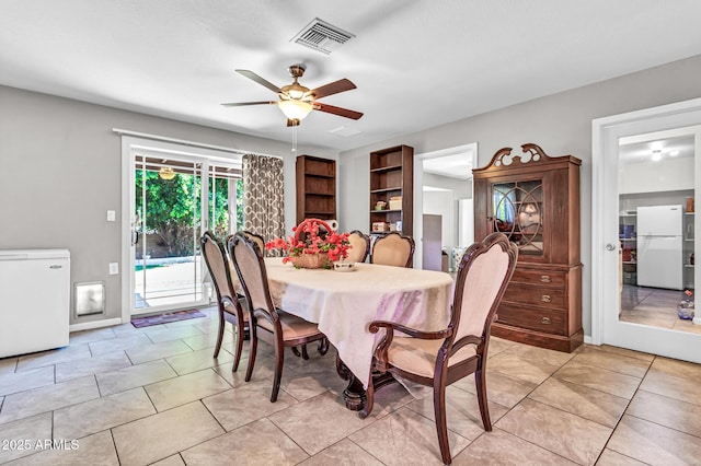 6055 E Hannibal St, Mesa, AZ 85205 - dining area with a ceiling fan and light tile patterned flooring
