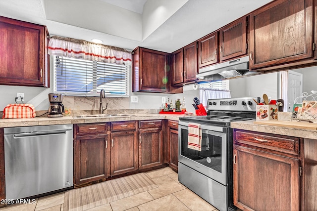 6055 E Hannibal St, Mesa, AZ 85205 - kitchen featuring appliances with stainless steel finishes, under cabinet range hood, light countertops, and light tile patterned floors