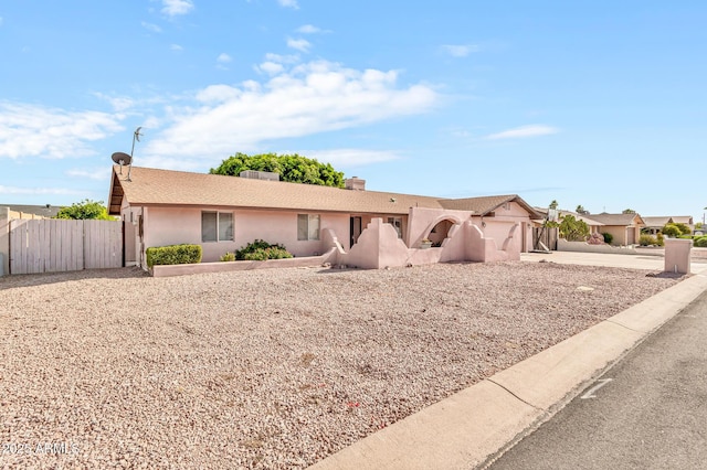 6055 E Hannibal St, Mesa, AZ 85205 - view of front of property featuring stucco siding, a garage, and driveway